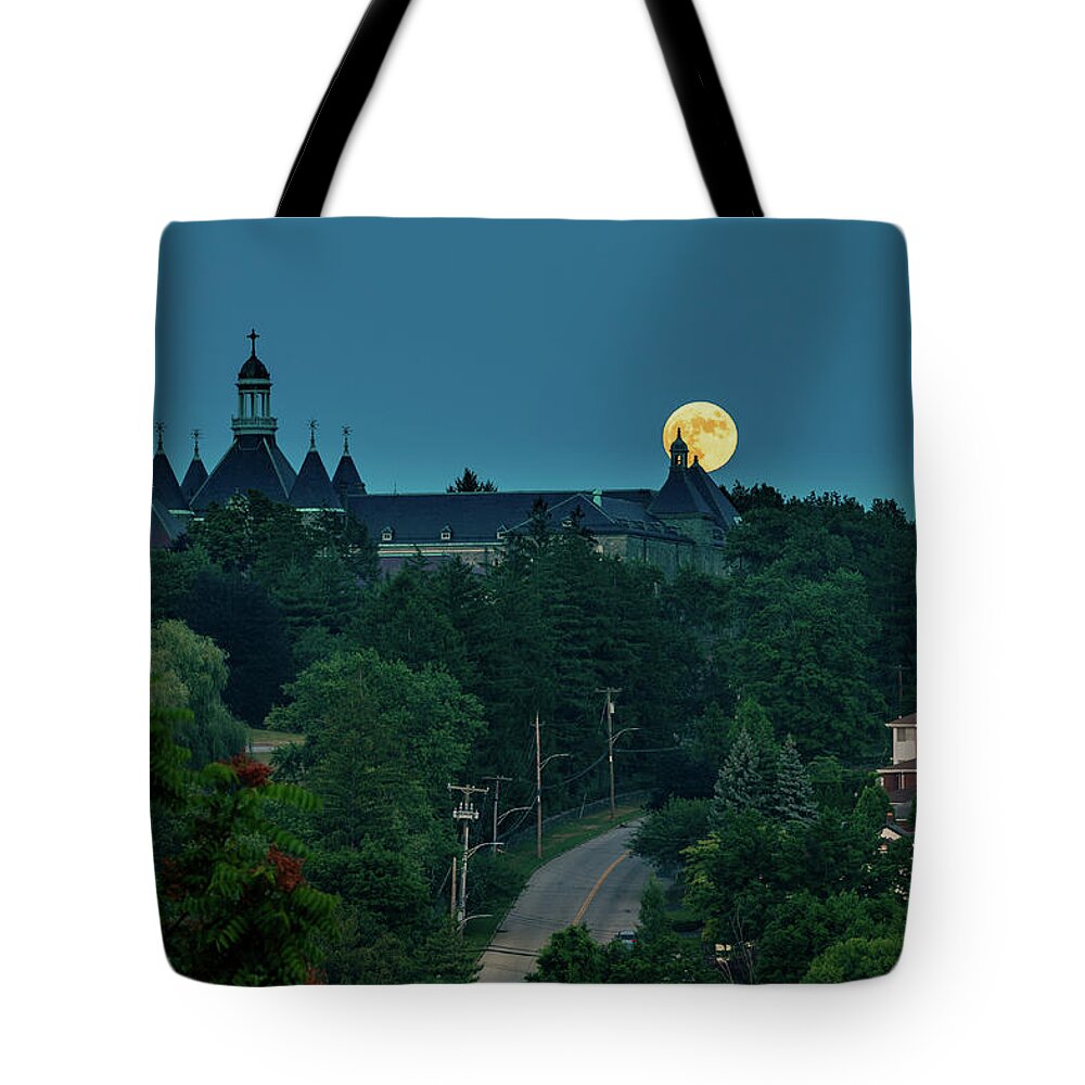 Dunwoodie Tote Bag featuring the photograph Moonrise over Dunwoodie 2 by Kevin Suttlehan