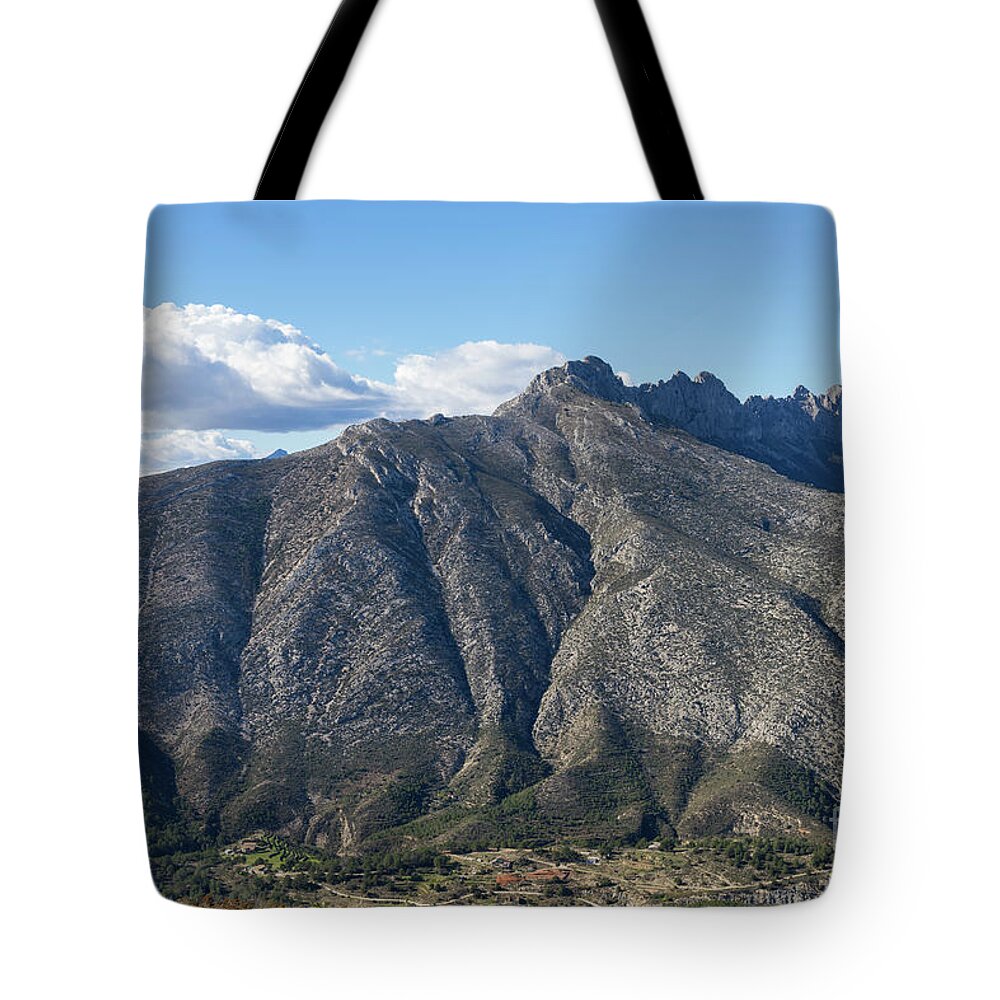 Mountain Landscape Tote Bag featuring the photograph Sierra de Bernia mountain ridge and clouds by Adriana Mueller