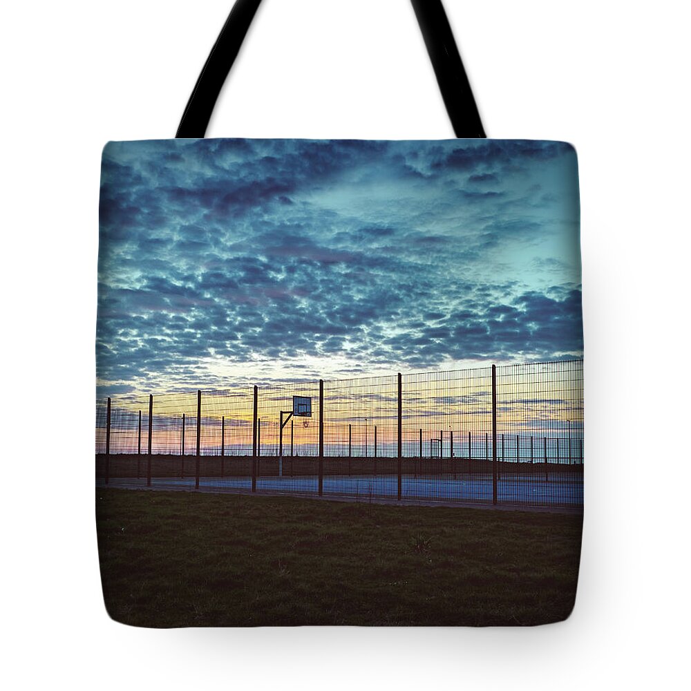 Basketball Court Tote Bag featuring the photograph Nets at sunset by Nick Barkworth