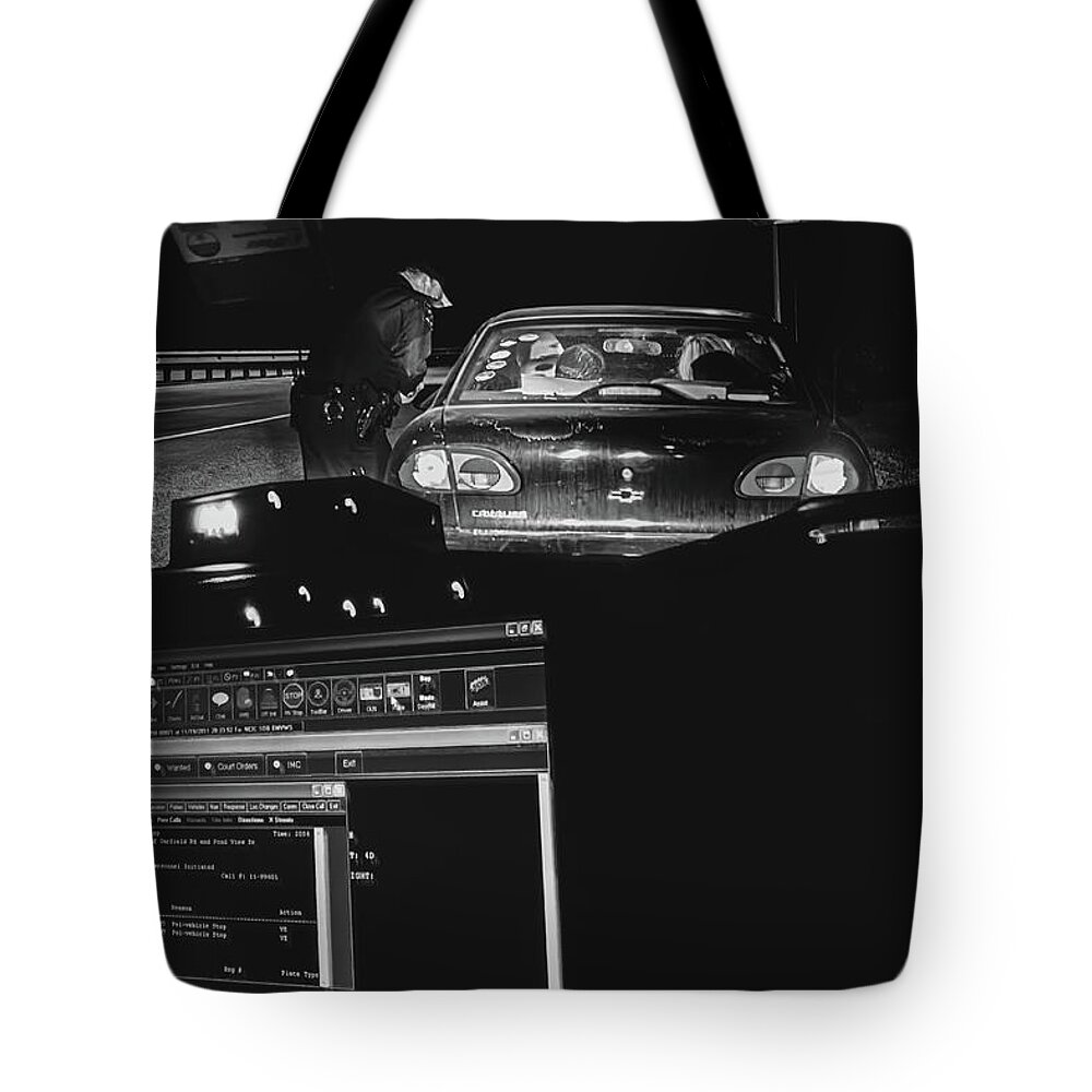 Police Tote Bag featuring the photograph Night Traffic Stop by Bob Orsillo