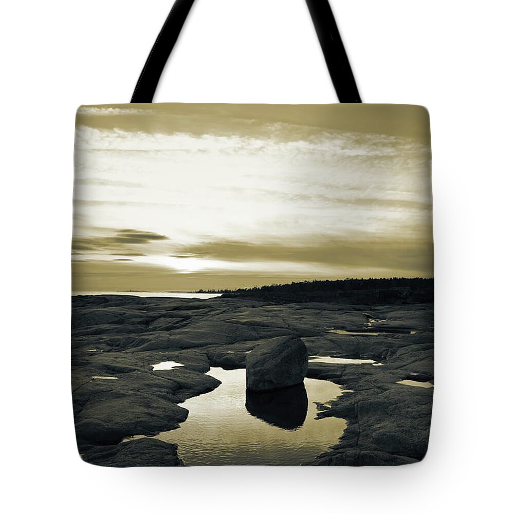 Abstract Tote Bag featuring the photograph Nightfall at the rocky shore of the Baltic Sea - duotone by Ulrich Kunst And Bettina Scheidulin