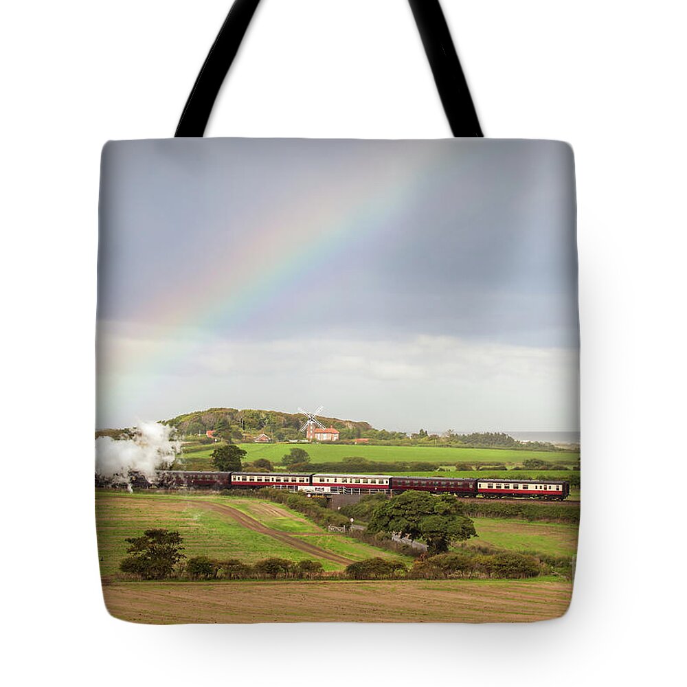 Weybourne Tote Bag featuring the photograph Norfolk steam train with Weybourne windmill and rainbow by Simon Bratt