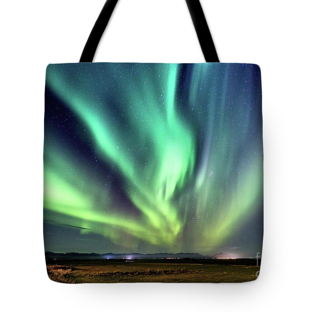 Iceland Tote Bag featuring the photograph Northern lights, Aurora Borealis in the night sky, Iceland. Thes by Jane Rix