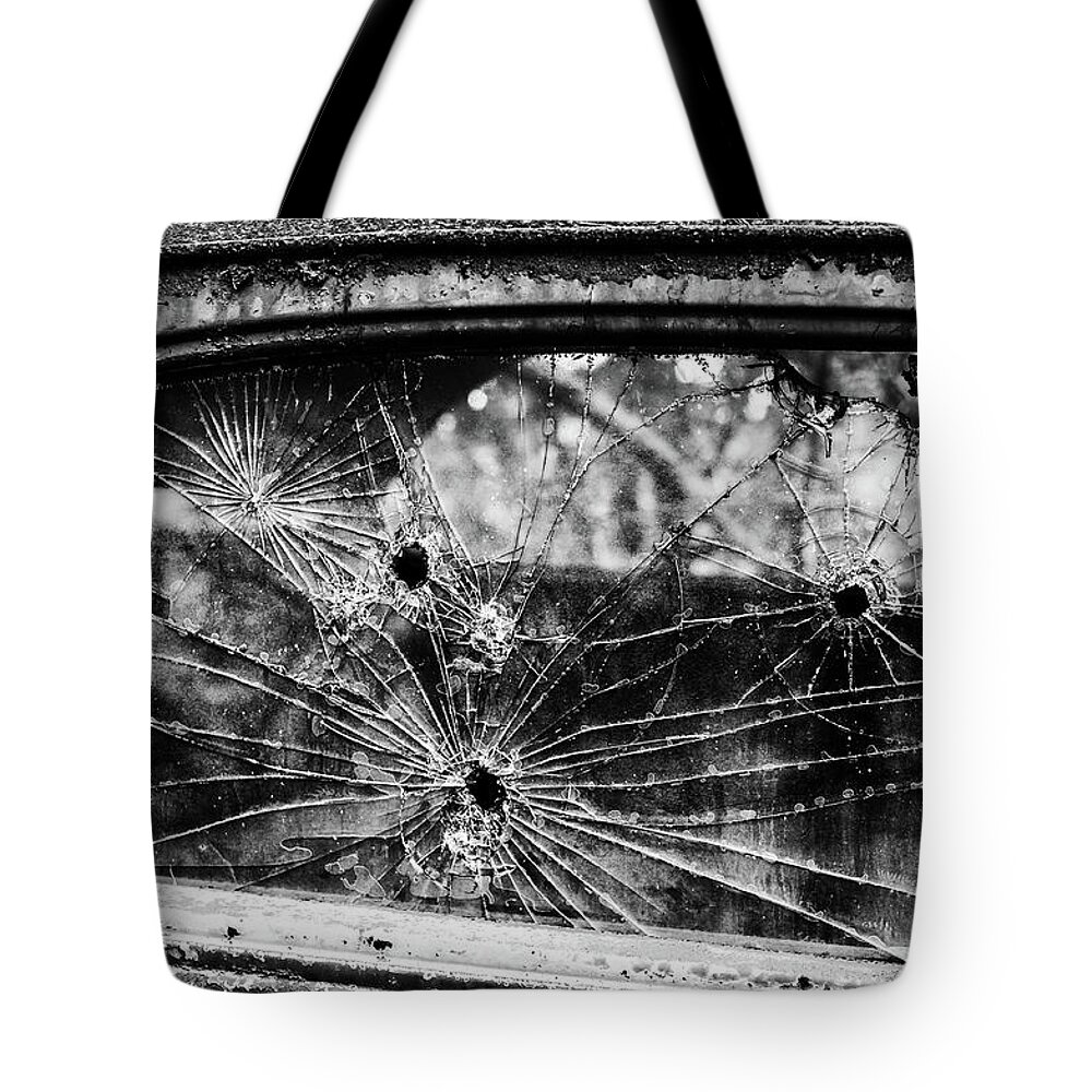 Flemings Tote Bag featuring the photograph Not Bulletproof by Louis Dallara
