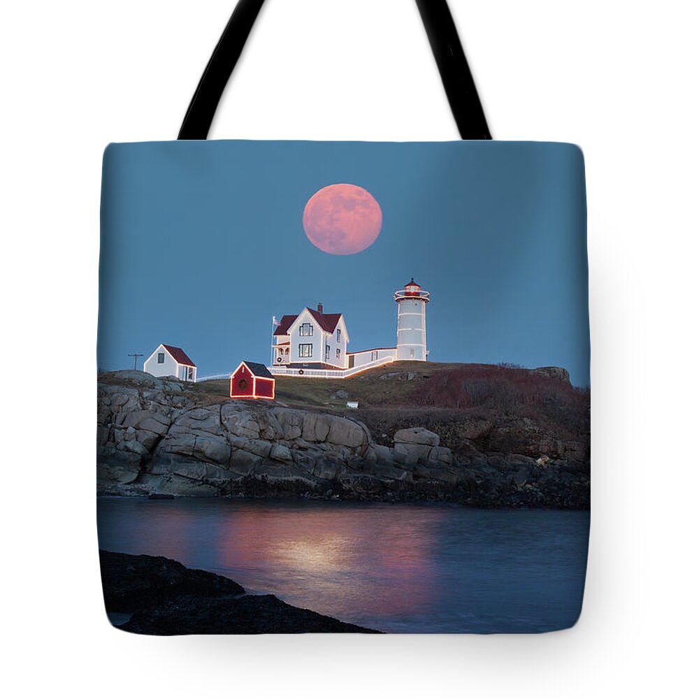 Cape Neddick Tote Bag featuring the photograph Nubble Lighthouse lit for the season by Jeff Folger