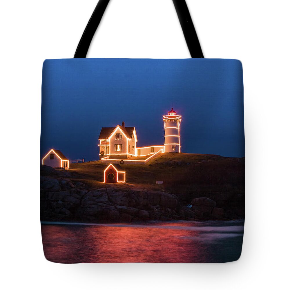 Maine Lighthouse Tote Bag featuring the photograph Nubble lighthouse with Christmas Lights by Jeff Folger