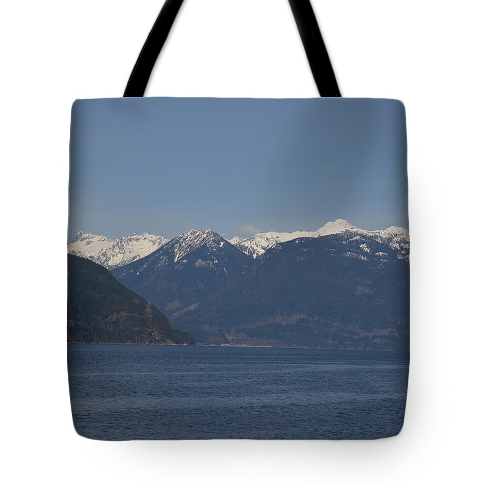 Ocean Tote Bag featuring the photograph Ocean leading to Snow Capped Mountains by James Cousineau