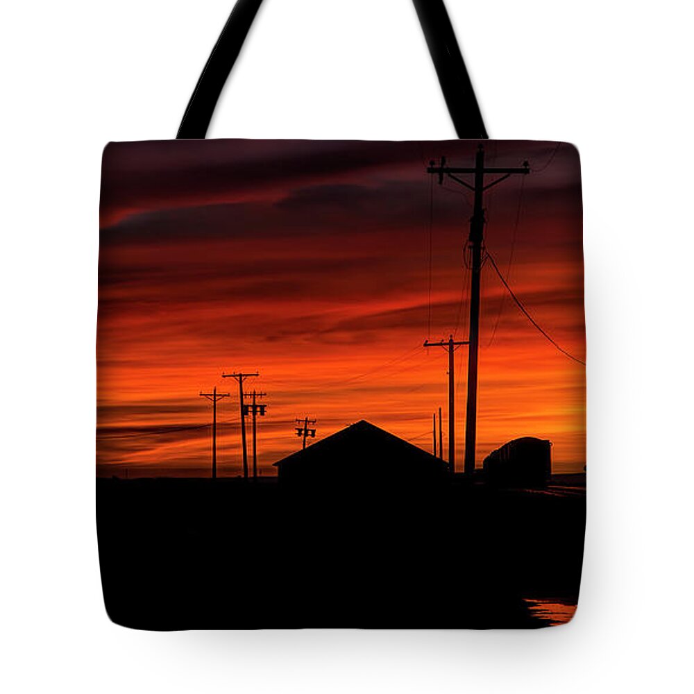 Orange Sky Tote Bag featuring the photograph October Glow by Steve Sullivan
