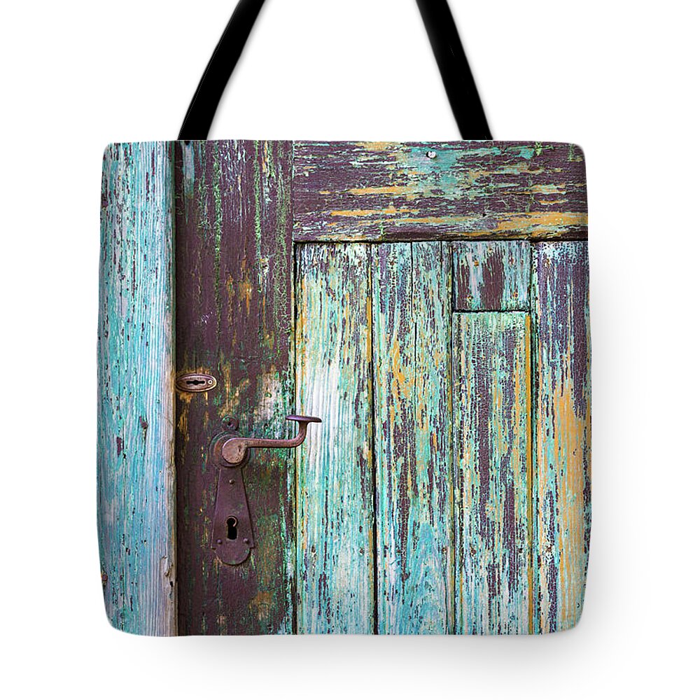 Wood Tote Bag featuring the photograph Old door detail by Viktor Wallon-Hars