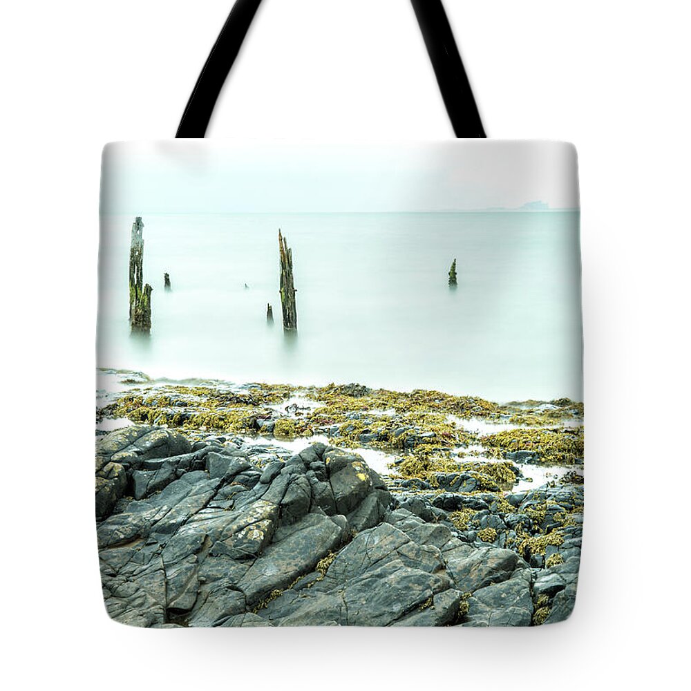 Holy Island Tote Bag featuring the photograph Old Posts and the Rocks - wide angle view by John Paul Cullen