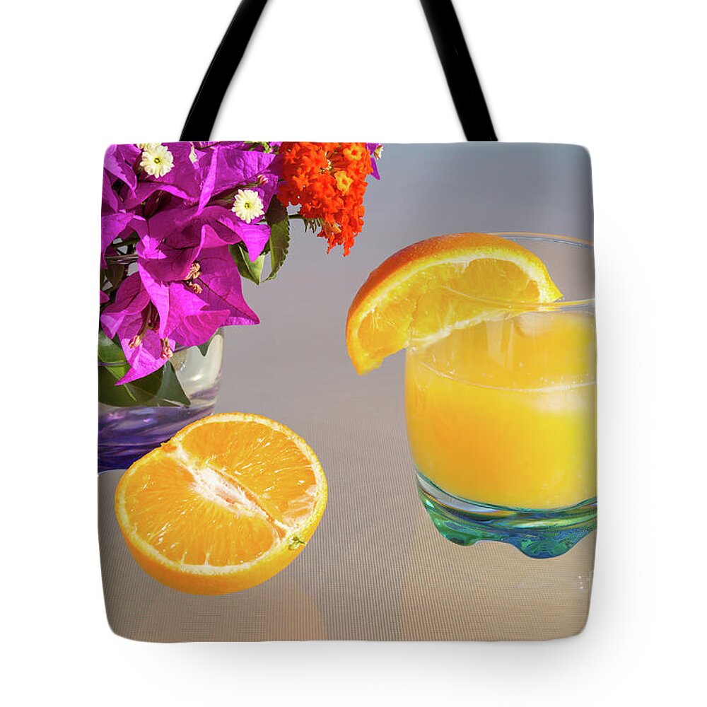 Orange Tote Bag featuring the photograph Orange and tangerine fruit juice in the sunshine by Adriana Mueller