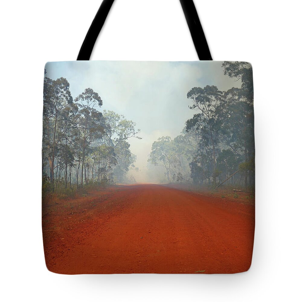 Outback Tote Bag featuring the photograph Outback Road into Bush Fire by Maryse Jansen