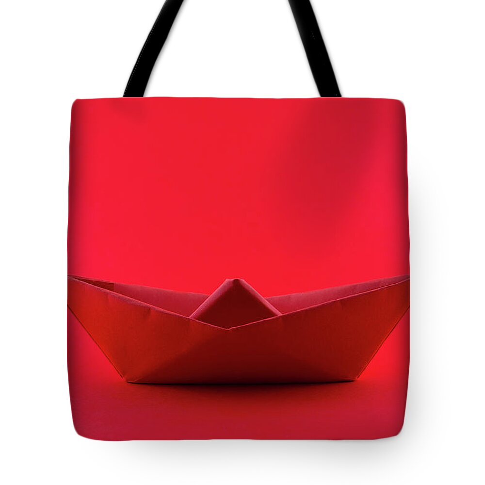 Paper Boat Tote Bag featuring the photograph Paper boat by Fabiano Di Paolo