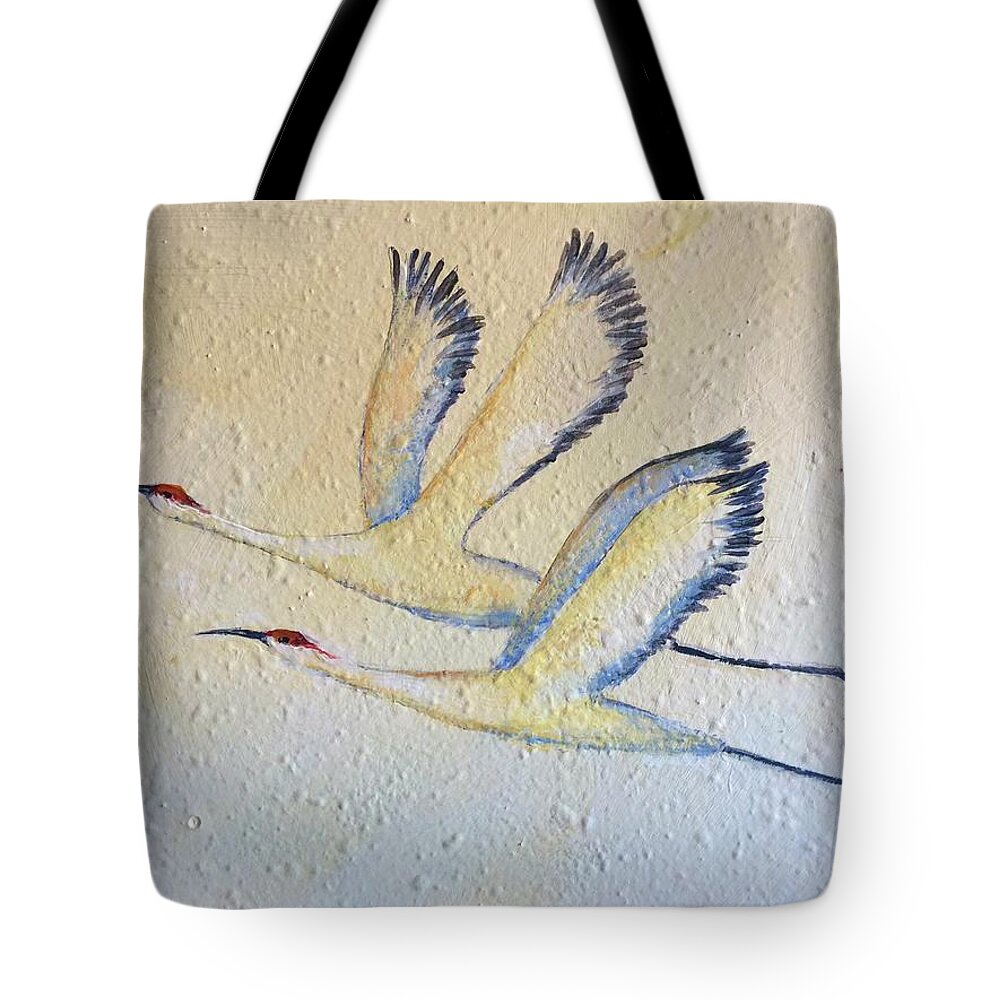 Cranes In Flight Tote Bag featuring the painting Partners for Life by Caroline Patrick