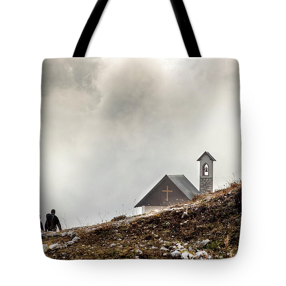 Italian Alps Tote Bag featuring the photograph People hiking the trail to the church at Tre cime di lavadero. Italian Alps Italy by Michalakis Ppalis