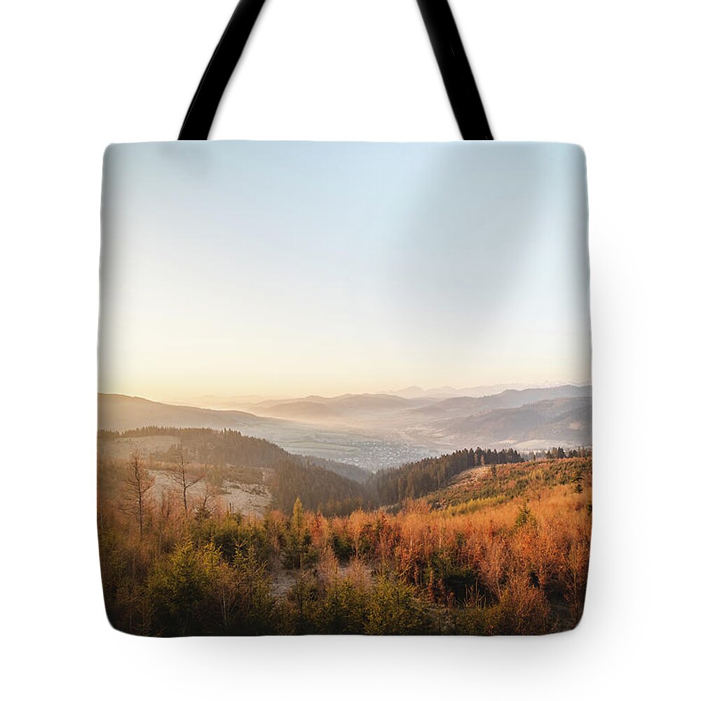 Zborov Nad Bystrinou Tote Bag featuring the photograph Phenomenal sunrise and colourful forests by Vaclav Sonnek