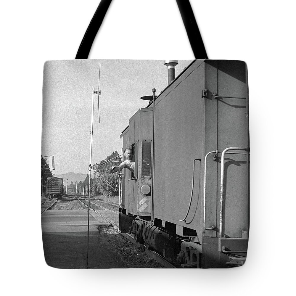 Railroads Tote Bag featuring the photograph Picking Up Train Orders in Caboose by Frank DiMarco