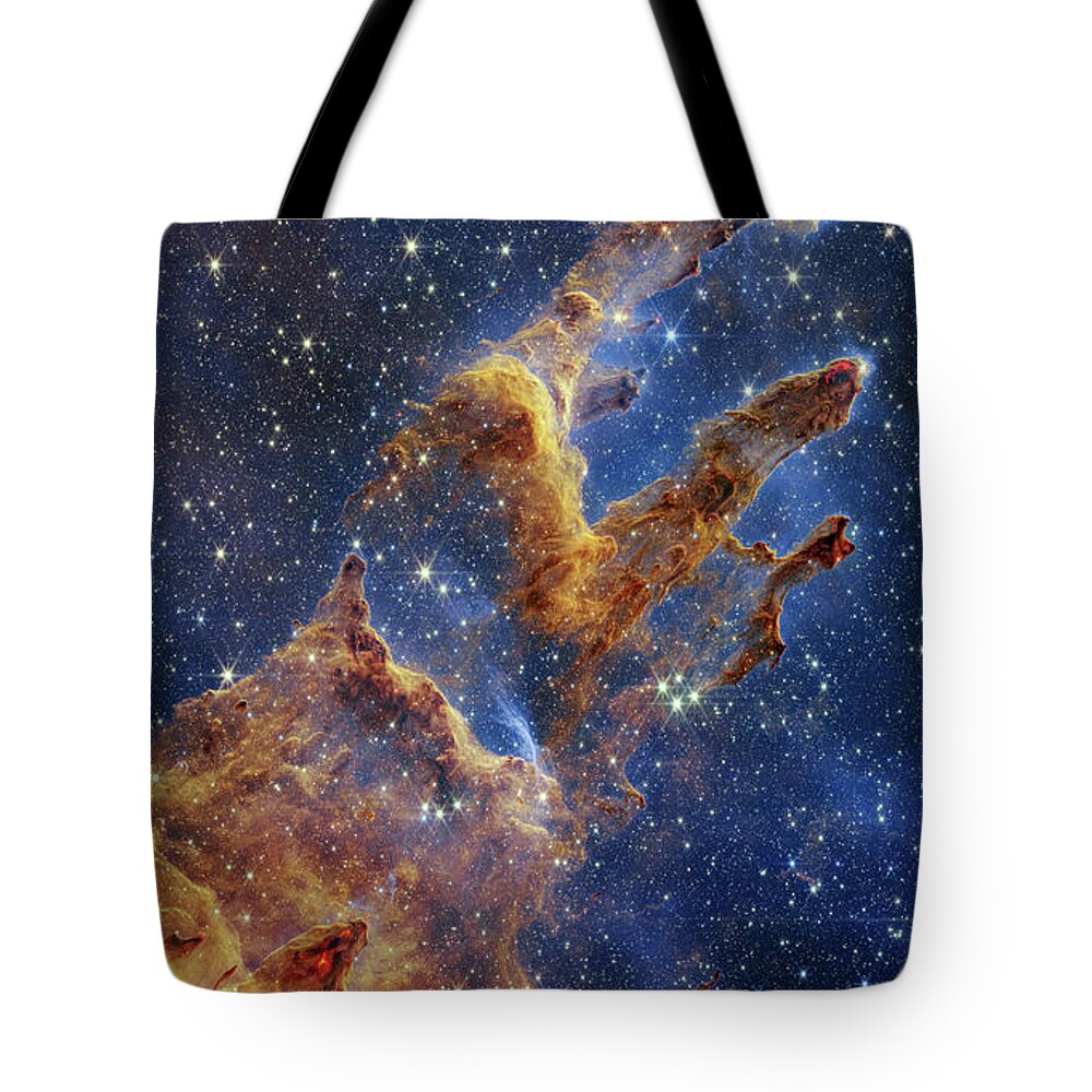 M16 Tote Bag featuring the photograph Pillars of Creation, JWST image by Science Photo Library