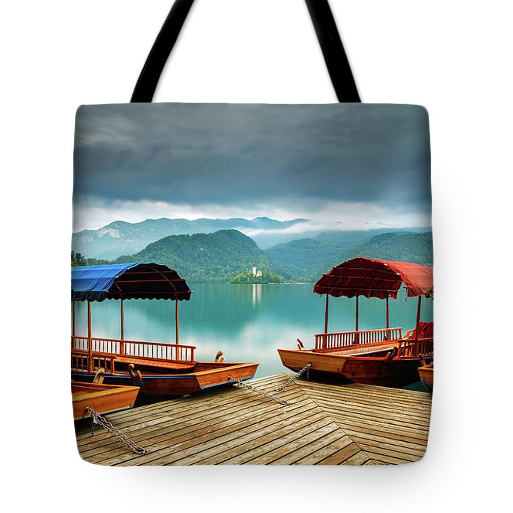 Bled Tote Bag featuring the photograph Pletna Boats at Lake Bled by Ian Middleton