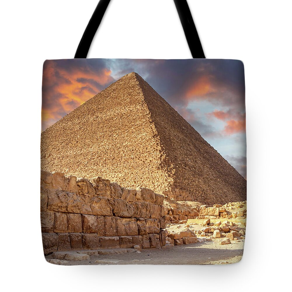 Pyramid Tote Bag featuring the photograph Pyramids of Giza, Cairo, Egypt at sunset. Built by the Pharaohs as a tomb and passage to the afterlife, where they believed they would be Gods. by Jane Rix