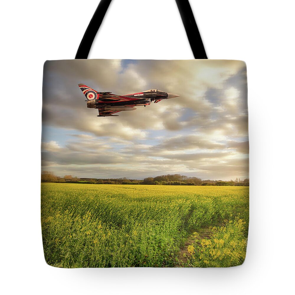 Raf Tote Bag featuring the photograph RAF Typhoon Eurofighter jet flying over rapeseed crops by Simon Bratt