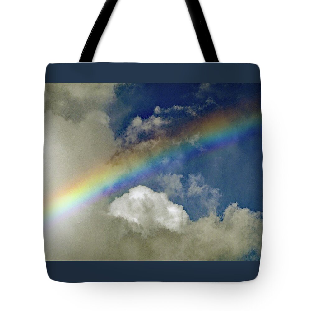 Rainbow Tote Bag featuring the photograph Rainbow in the Clouds by Corinne Carroll
