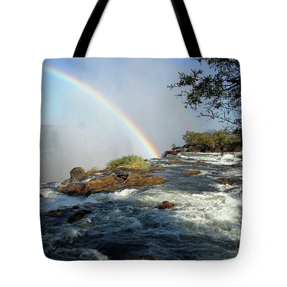Blue Tote Bag featuring the photograph Rainbow Over The Falls by Sandy Poore