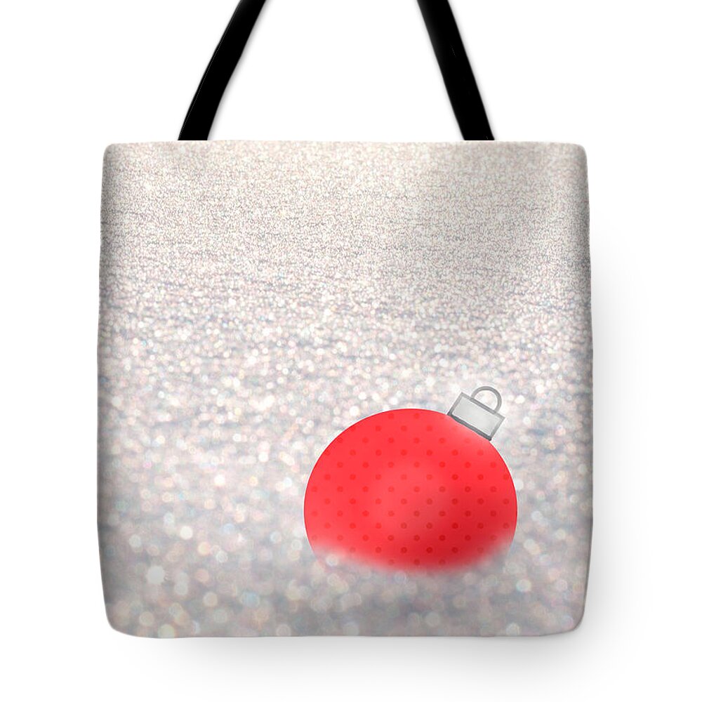 Red Ball Tote Bag featuring the mixed media Red Ball in Snow by Moira Law