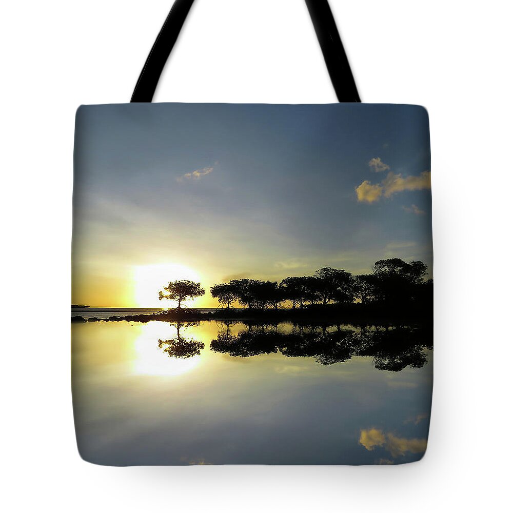Reflections Tote Bag featuring the photograph Reflections Of A Tropical Sunset In The Shallows by Joan Stratton