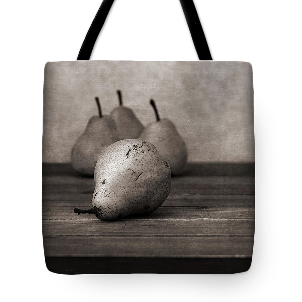 Rejection Tote Bag featuring the photograph Rejected by the group, still life with pears by Alessandra RC
