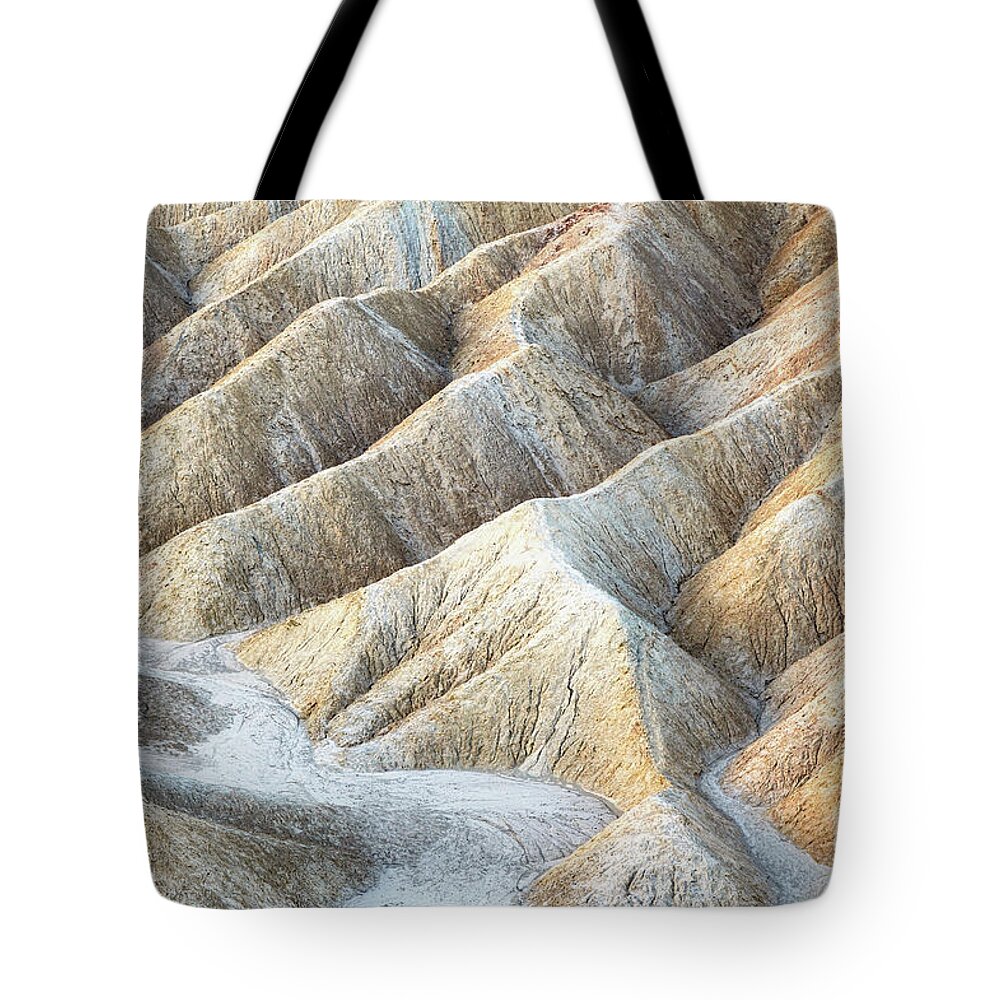 Death Valley Tote Bag featuring the photograph Ripples of eroded stone at Zabriskie Point, Death Valley, California. by Jane Rix
