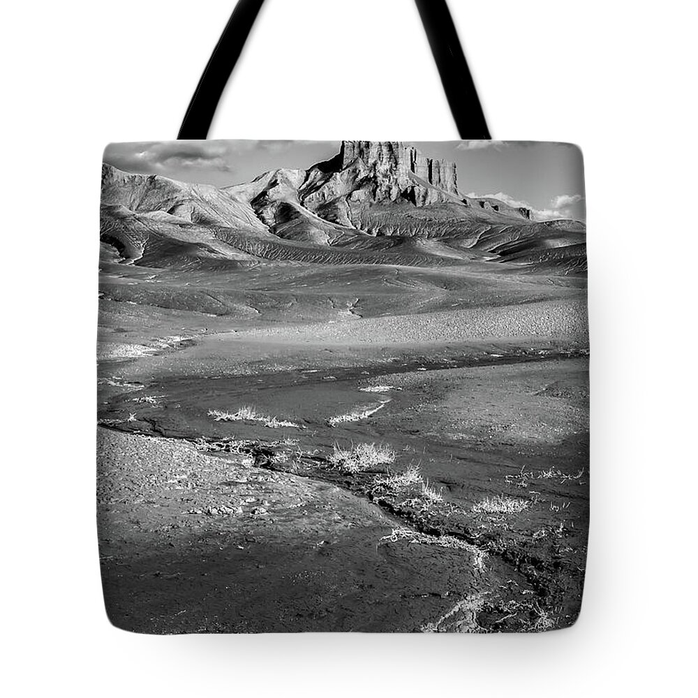 Utah Tote Bag featuring the photograph Rock spire rising above the desert floor by Robert Miller