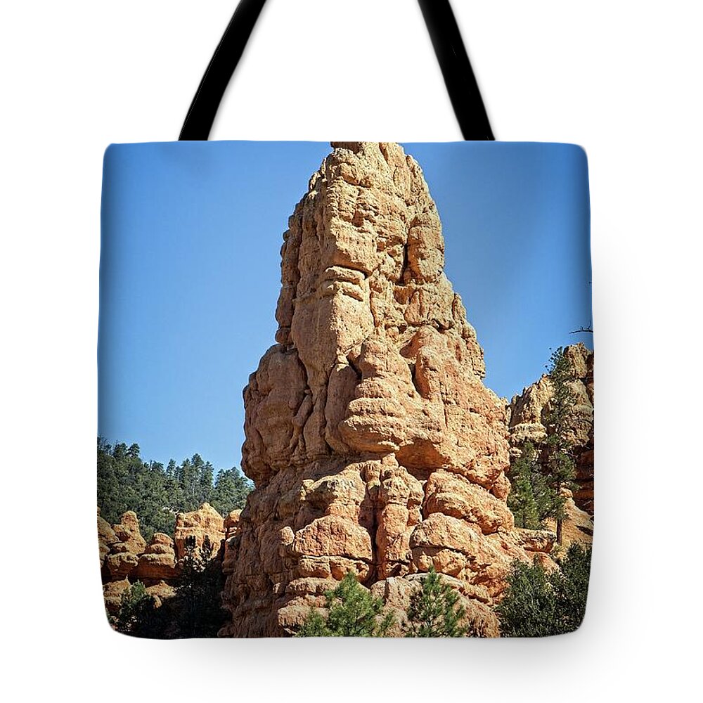 Blue Tote Bag featuring the photograph Rock Spire by Ronald Lutz