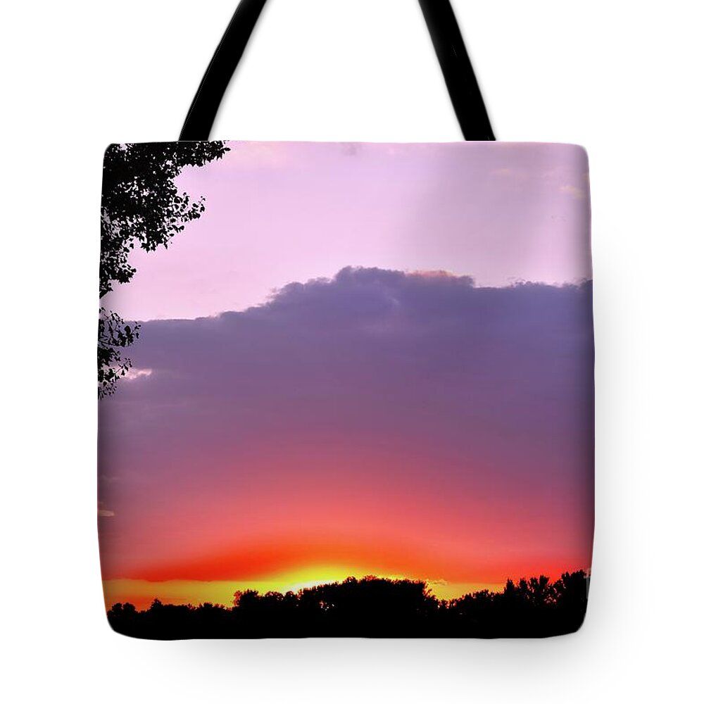Romantic Sunset With Purple Cloud Tote Bag featuring the photograph Romantic Sunset with Purple Cloud by Leonida Arte