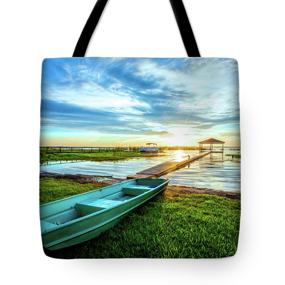 Docks Tote Bag featuring the photograph Rowboat at the Water's Edge by Debra and Dave Vanderlaan