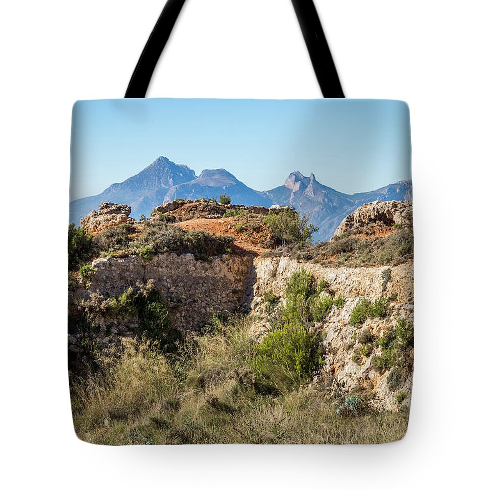 Fortress Tote Bag featuring the photograph Ruins of an ancient fortress in the mountains by Adriana Mueller
