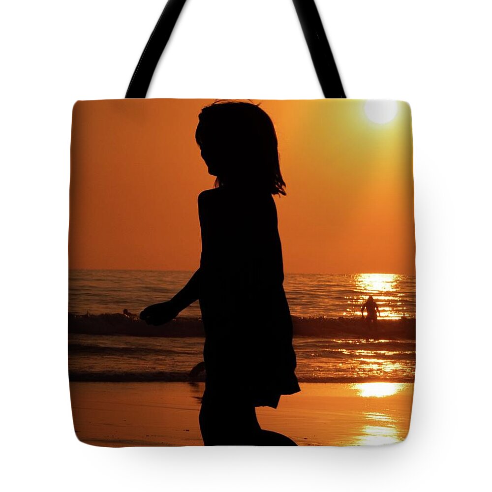 Solana Beach Tote Bag featuring the photograph Running through the Sunset by Anthony Giammarino