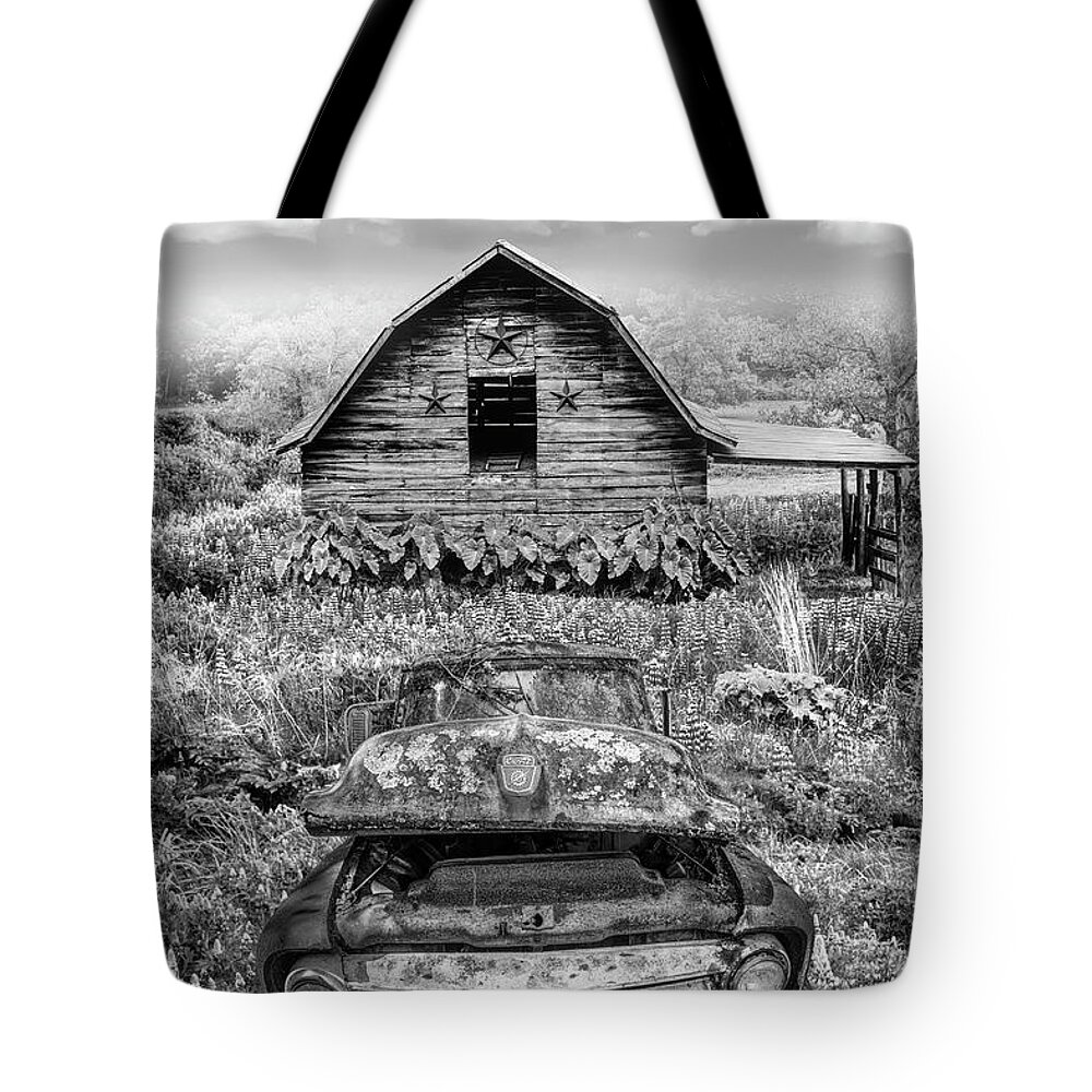 Chevy Tote Bag featuring the photograph Rusty Ford by the Star Barn Black and White by Debra and Dave Vanderlaan
