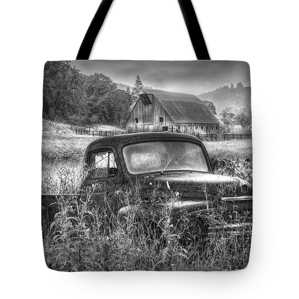 Barns Tote Bag featuring the photograph Rusty Truck Deep in the Wildflowers in Black and White by Debra and Dave Vanderlaan
