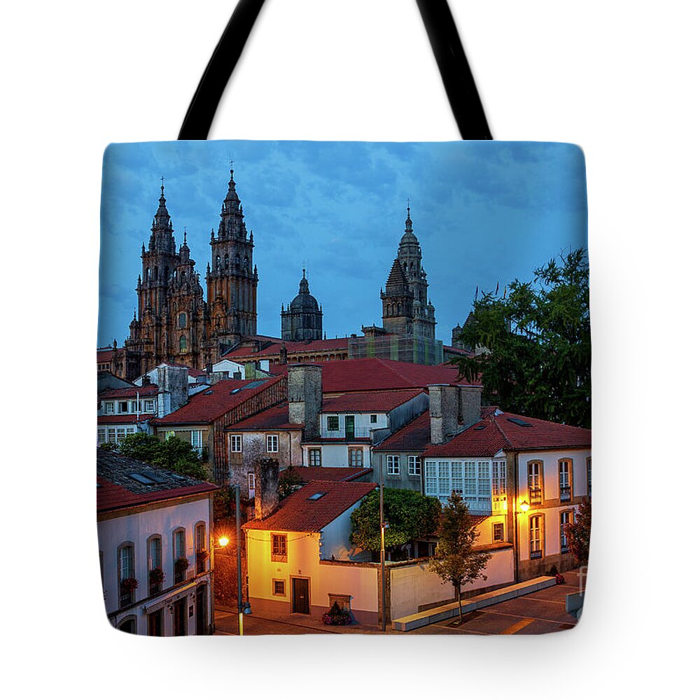 Way Tote Bag featuring the photograph Santiago de Compostela Cathedral Spectacular View by Night Dusk with Street Lights and Tiled Roofs La Corua Galicia by Pablo Avanzini