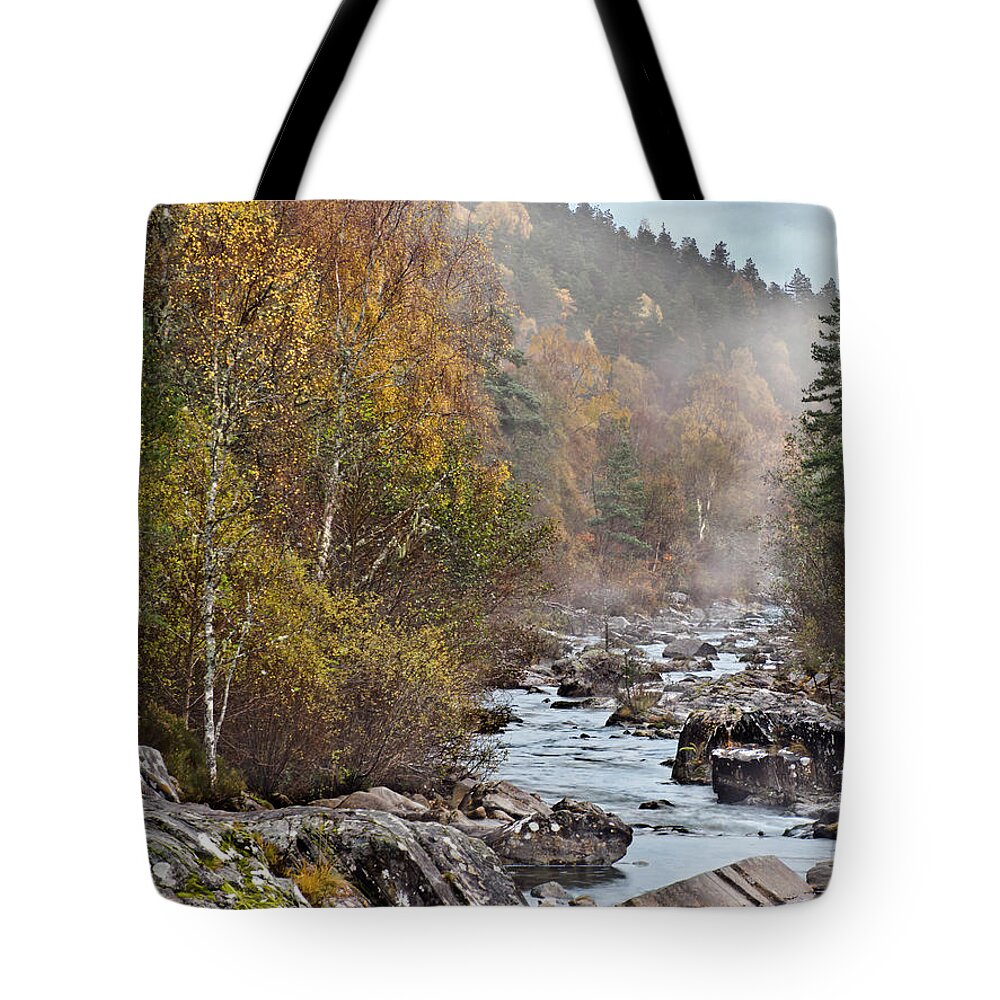 Fog Beauty Over River Scottish Golden Autumn Stones Boulders Cobbles Gravel Pebble Rocks Scree Birches Yellow Green Woods Forest Nature Elements Landscape View Scenery Water Flow Beautiful Delightful Pretty Calm Restful Relaxing Relaxation Serenity Atmospheric Aesthetic Mindfulness Magnificent Powerful Stunning Walking Art Artistic Painterly Imaginable Beauty Fresh Untouched Nobody Solitary Delicate Gentle Scotland River Scottish Highlands Uk Impression Expressive Misty Fall Vista Smart River Tote Bag featuring the photograph Fog Beauty Over River Scottish Golden Autumn by Tatiana Bogracheva