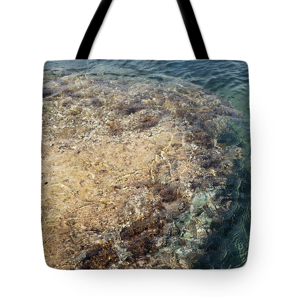 Mediterranean Tote Bag featuring the photograph Sea water and rocks in a cove on the Mediterranean coast by Adriana Mueller