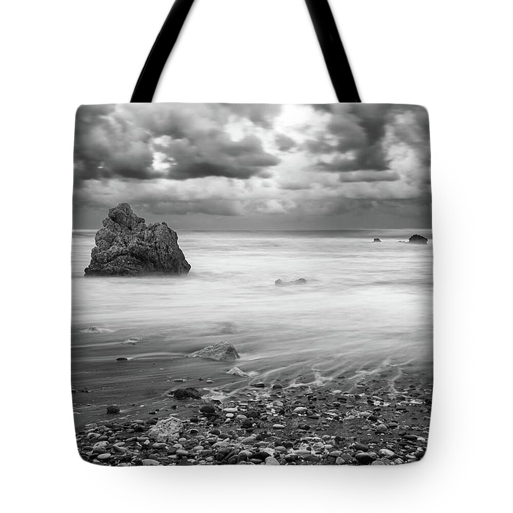Seascape Tote Bag featuring the photograph Seascape with windy waves during stormy weather. by Michalakis Ppalis