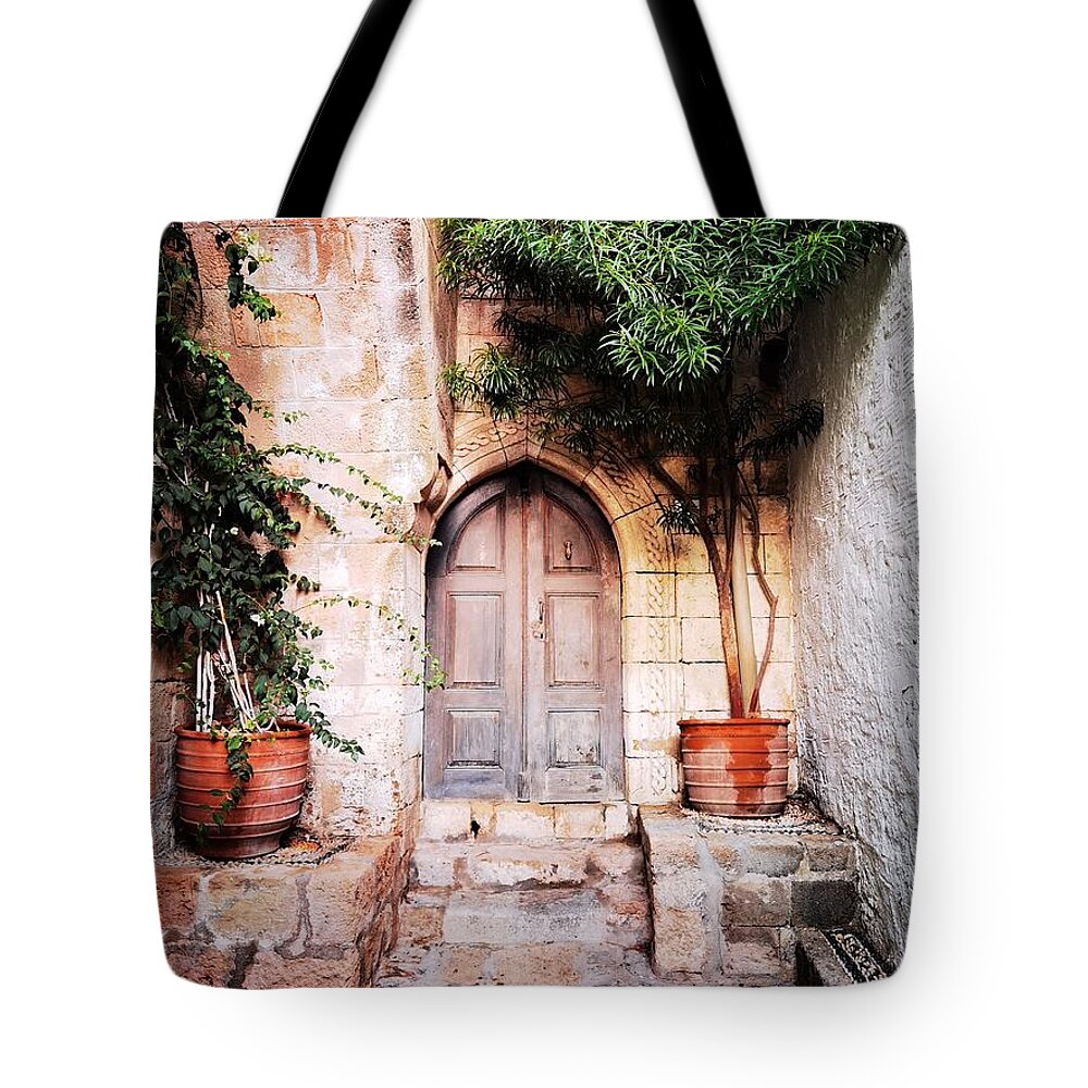 Wooden Door Tote Bag featuring the photograph Secluded portal by Jarek Filipowicz