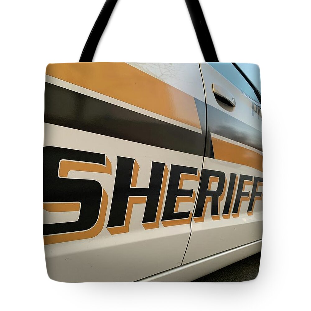 Sheriff Tote Bag featuring the photograph Sheriff by Lee Darnell