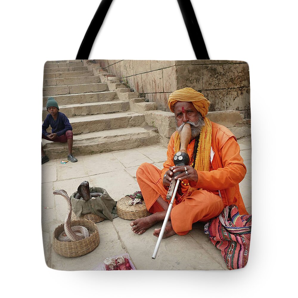 Scary Tote Bag featuring the photograph Snake charmer with his snakes by Steve Estvanik