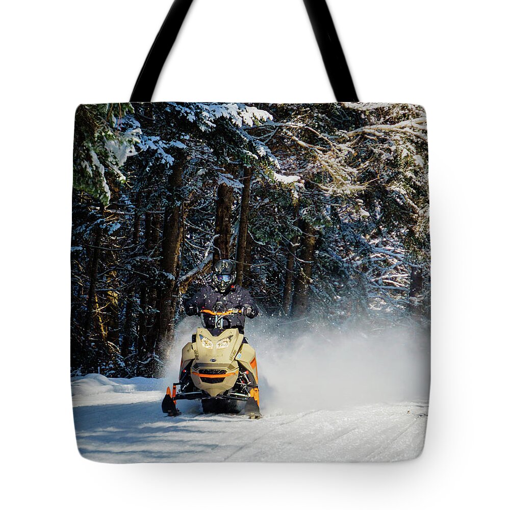America Tote Bag featuring the photograph Snowmobiler Riding Down Trail - Pittsburg, New Hampshire by John Rowe