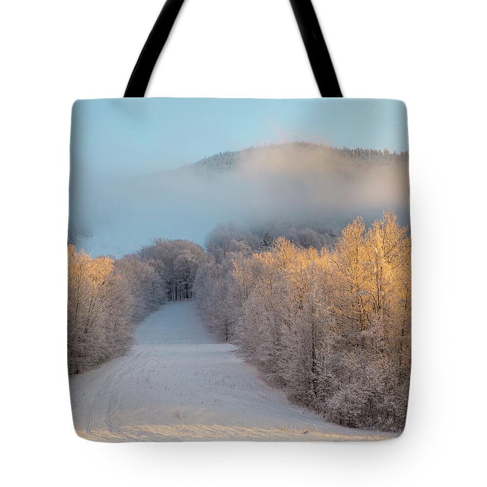 Snowy Tote Bag featuring the photograph Snowy Ski Slope Sunset by White Mountain Images