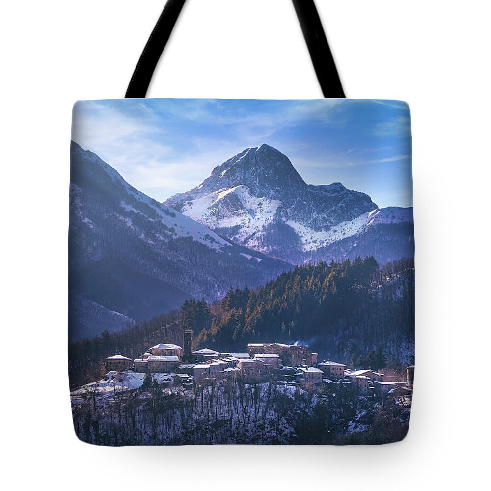 Garfagnana Tote Bag featuring the photograph Snowy village in Alpi Apuane by Stefano Orazzini