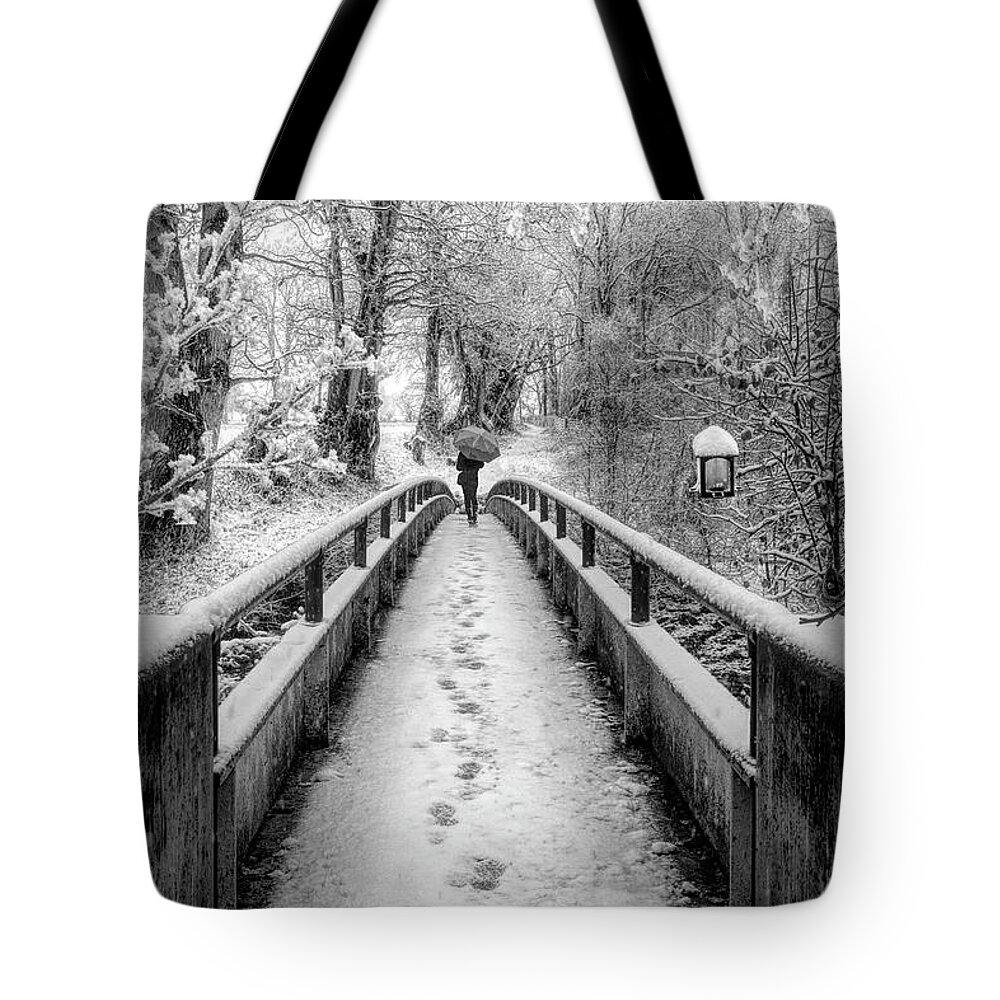 Bridge Tote Bag featuring the photograph Snowy Walk in Black and White by Debra and Dave Vanderlaan